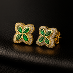 Four Leaf Clover‑shaped earrings covered in small sparkling stones.