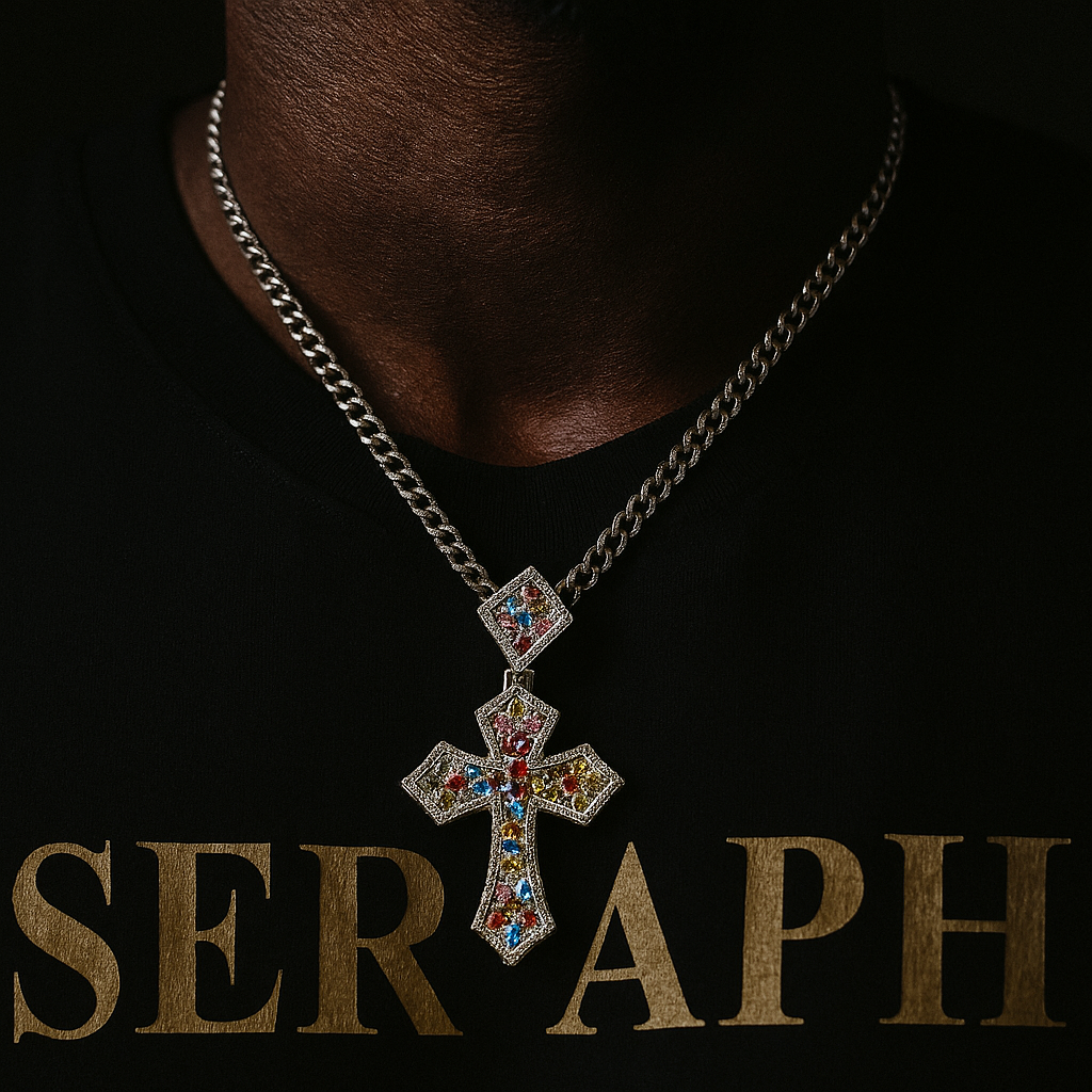 Cross pendant decorated with stones of various colours, forming a rainbow pattern.