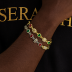 Bracelet featuring alternating coloured stones set in gold‑tone links.